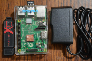 The Pi 2 is only slightly bigger than the power adapter plug.